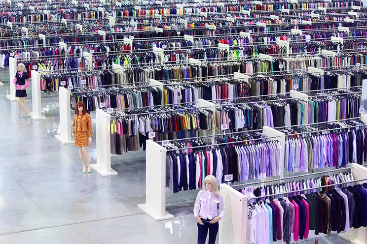 Big clothing shop, showing row after row of stacked clothing racks