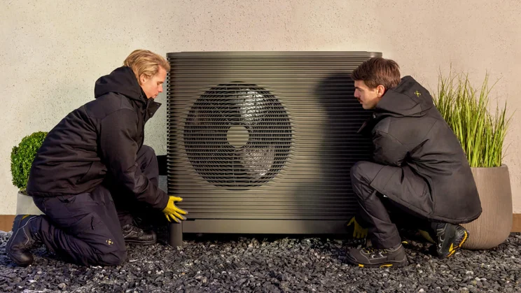 Aira installers installing Aira heat pump