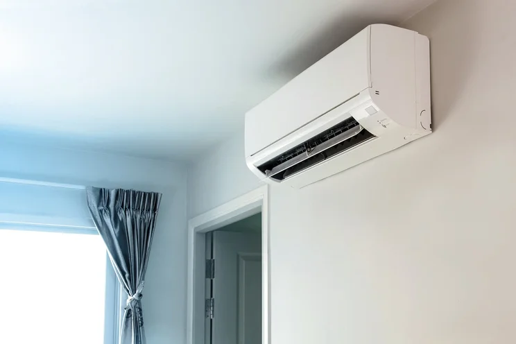 air conditioning unit attached to wall in house
