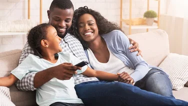 Cosy family on sofa