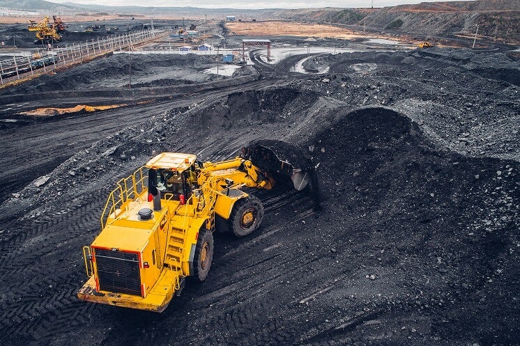 a digger collecting coal
